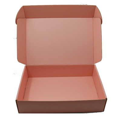L'annonce ondulée rose enferme dans une boîte la boîte de empaquetage ondulée écologique